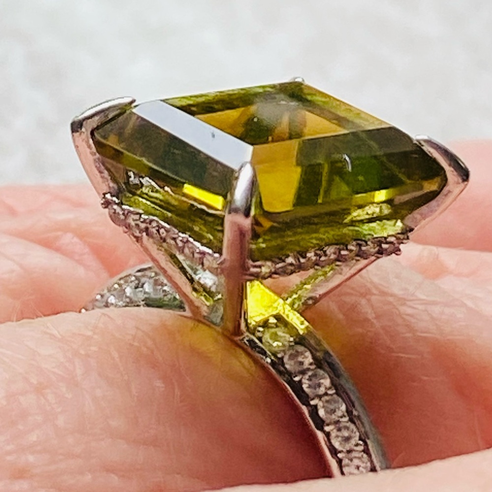 Green and Silver Emerald Cut Ring with Modern Design